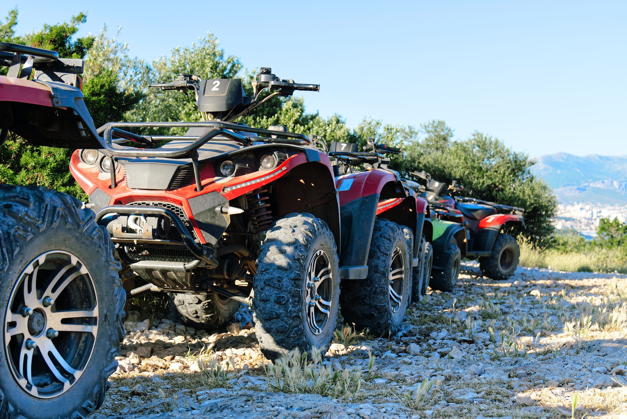 Parked ATV and UTV, mountain road. parked in a row several atv extreme outdoor adventure concept